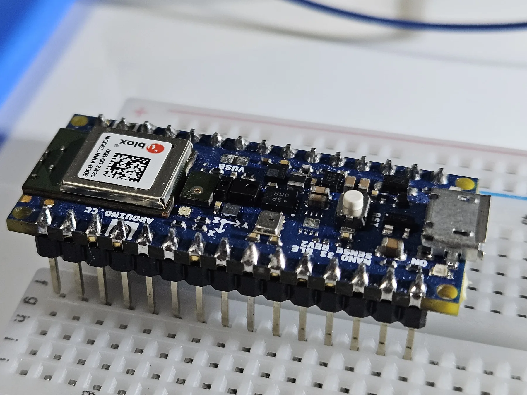 Arduino Nano 33 BLE Sense Rev2 shown at a three-quarter angle on the measurement bench.