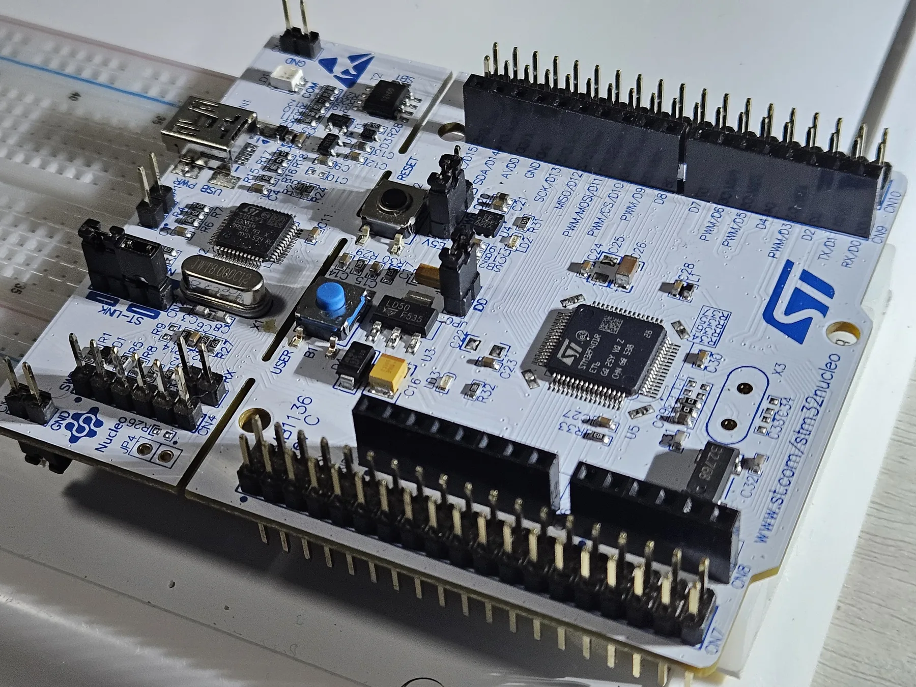 STM32 NUCLEO-F401RE shown at a three-quarter angle on the measurement bench.